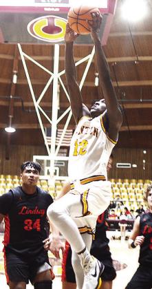 No. 12 Atticus Thompson flies through the air on the way to the hoop during Clinton’s recent home contest against Lindsay in the Tornado Dome. CDN | Sam Goodwyn