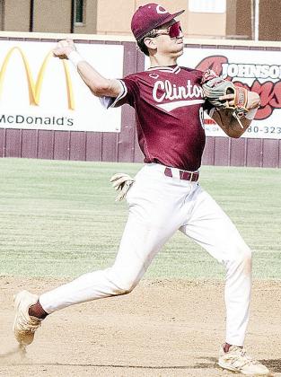 Clinton’s Declan Brown hurls the ball toward first for the out during the Reds’ summer game against Weatherford. CDN | Sam Goodwyn