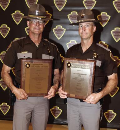 Lt. Steven Cornell, left, and Lt. Aaron Hunter, of Oklahoma Highway Patrol’s Troop H, hold their plaques designating their Trooper of the Year Award for Valor at Tuesday’s awards ceremony at the National Guard Armory in Norman. CDN | Courtesy photo