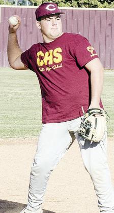 Clinton’s Eli Anderson aims the ball as he prepares to throw it during a Reds’ baseball practice. CDN | Sam Goodwyn