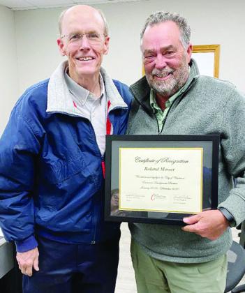 CEDA Chairman Ken Baker, left, presents recognition to Roland Mower, who attended his final meeting as director of economic development. CDN | Staff Photo
