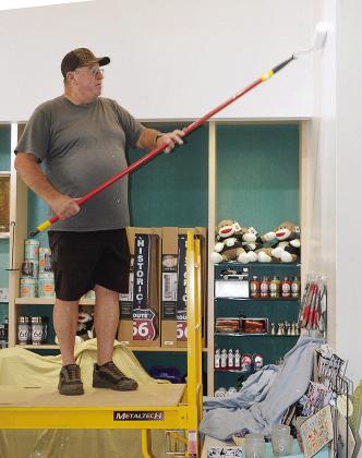 Jim Littke applies a fresh coat of paint to the gift shop area Thursday at the Oklahoma Route 66 Museum. CDN | Christian Jacobsen