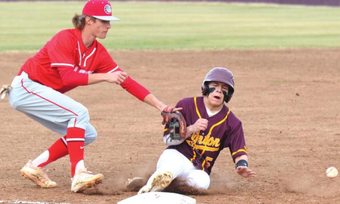 Late miscues cost Reds in opener