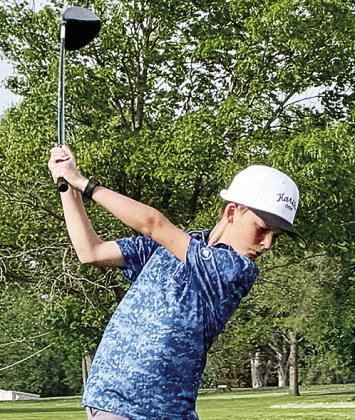 Clinton’s Karsten Moore gets into his back swing as he prepares to hit the golf ball during a seventh-grade golf tournament. CDN |Courtesy Photo