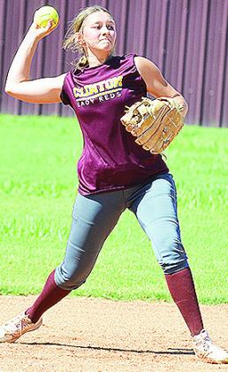 Clinton’s Hadley Meget hurls the ball to first during a drill Tuesday at the softball field. CDN | Sam Goodwyn