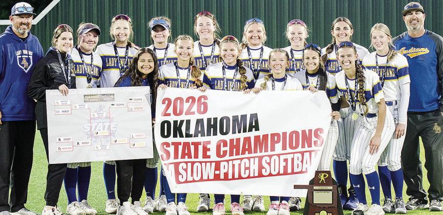 The Arapaho-Butler Lady Indians celebrate winning the 2026 Class 3A Slow-Pitch State Championship Wednesday at FireLake Ball Fields. Pictured from left, in front, are Adrian Randle, Kylin Oakes, Izzie Dewees, Reagan Schoeppach, Maddi Lockhart and Piperrilee Sawatzky; back, Coach Nathan Baker, Channing Cudd, Lauryn McHenry, Keely Baker, Peyton Lambeth, Kelsey Garibay, Lyla Pruitt, Dalaynie Lee, Kylee Brinkley, Presley Littke and Coach Luke Thompson. CDN | Sam Goodwyn