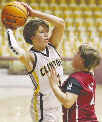 Clinton Middle School’s Braxton Garrison keeps the ball away from a Weatherford defender during the Whirlwinds’ eighthgrade game against the Eagles in the Tornado Dome. CDN |Steve Wheeler