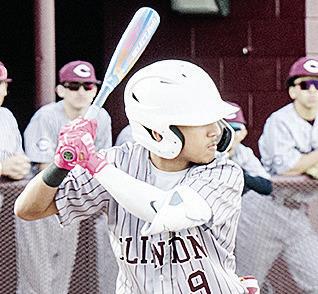 Clinton’s Azreal Fierros stares down the pitcher during the Reds’ win over Western Heights. CDN | Sam Goodwyn