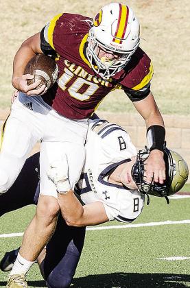 Clinton’s Liam Lofland, left, plows through a Kingfisher defender during the Red Tornadoes’ JV game against the Yellowjackets Monday in the Tornado Bowl. CDN |Sam Goodwyn