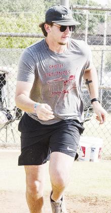 Jake Peeler hustles to first during his game in the Masonic Lodge’s softball tournament.