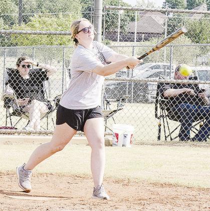 Bailey Troub hits the ball Saturday during Clinton’s Masonic Lodge’s softball tournament at Acme Brick Park.