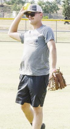 Cale McCoy throws the ball as he warms up prior to playing in the Masonic Lodge’s softball tournament at Schumacher Fields at Acme Brick Park. CDN | Sam Goodwyn