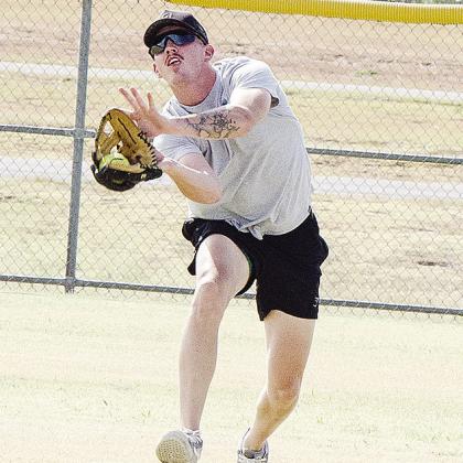 Danny Corbin reaches out and catches the fly ball in the outfield during the second game.
