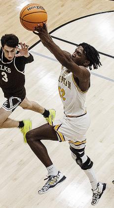 No. 12 Atticus Thompson takes flight against Elk City during Clinton’s playoff win over the Elks Thursday in Weatherford. CDN | Sam Goodwyn