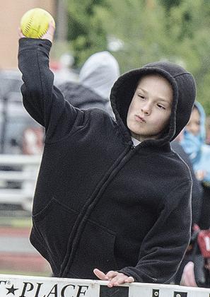 Hunter Hughes puts everything he has into throwing the softball during Little Olympics. CDN |Sam Goodwyn