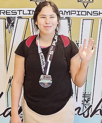 Clinton’s Jaeda Blackeagle smiles after finishing fifth in the 165-pound weight class of the 15U bracket during the OKWA State Wrestling Tournament over the weekend. CDN |Courtesy Photo