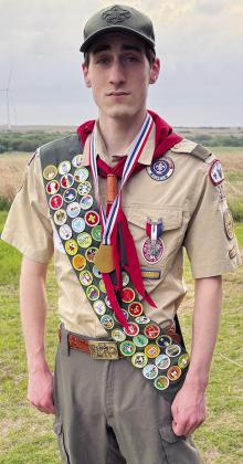 Owen Lavigne stands in his Eagle Scout uniform, decorated with more than 50 badges and various awards near Custer City. CDN | Courtesy photo