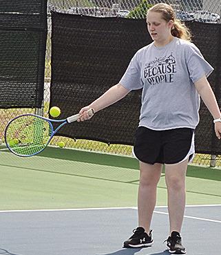 Clinton’s Sami Hammans returns the serve during tennis practice. CDN | Sam Goodwyn