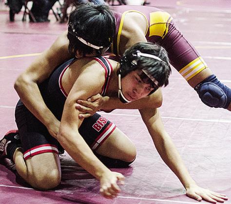CJ Begay, top, spins around his opponent during the first day of the Hub City Tournament Friday in the Tornado Dome. CDN | Sam Goodwyn