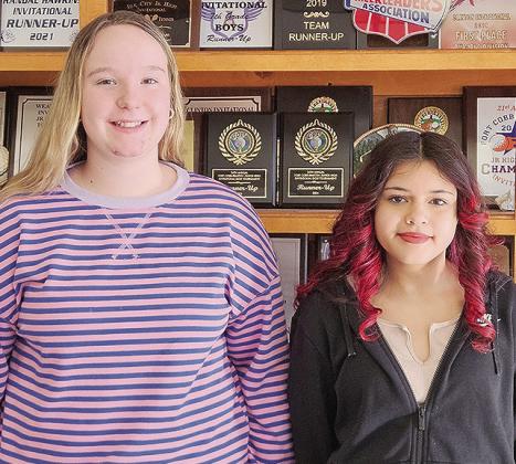 Clinton Middle School Spelling Bee runner-up Carli Patton, left, and winner Melanie Moy stand together after the competition winning word “hypnosis” was spelled. Moy will go on to represent Clinton Middle School at the district level. CDN | Courtesy p