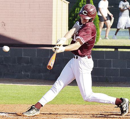 Clinton’s Ayden Crumley launches the ball into the outfield Thursday, as he gets a hit during the Reds’ home game against the Altus Bulldogs. CDN | Sam Goodwyn