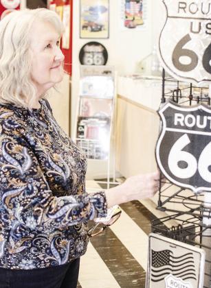 Terri O’Bryant of Oklahoma City checks out the souvenirs at the Oklahoma Route 66 Museum. CDN | Sam Goodwyn