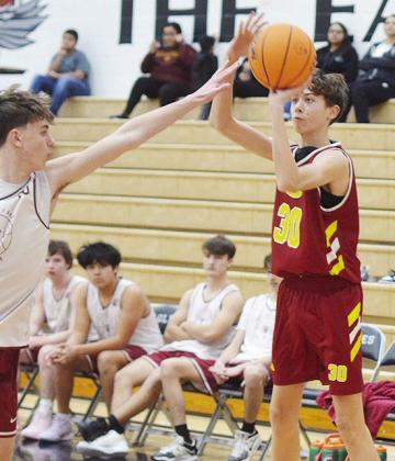 Conner Meget shoots over a defender during Clinton’s JV road game against Weatherford. CDN | Sam Goodwyn