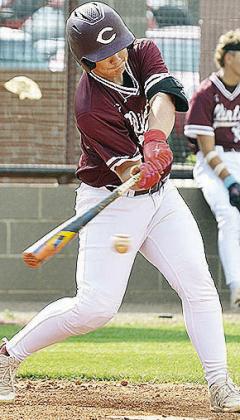 No. 3 Trason Lustfield swings hard at the ball during Clinton’s game against Kingfisher this summer. CDN | Sam Goodwyn