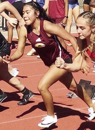 Clinton’s Savannah Flores takes off in the 100-meter race during the season-opening meet at Edmond North. CDN | Courtesy photo