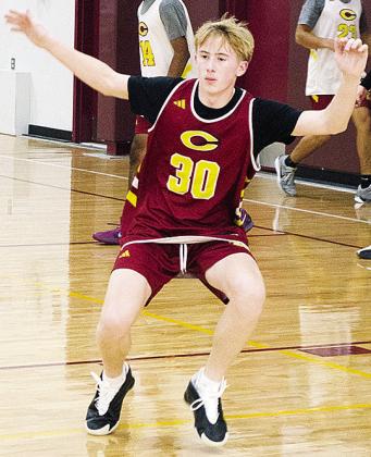 Axl Deatherage works on his defensive skills during basketball practice Wednesday in the practice gym. CDN | Sam Goodwyn