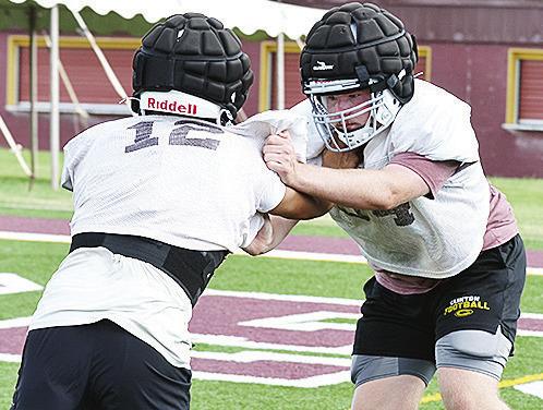 Connor Richardson, right, blocks against Alex Amaya in a blocking drill. CDN | Sam Goodwyn