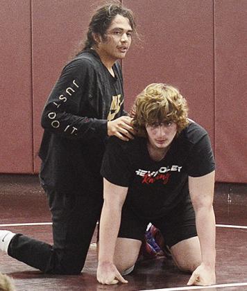 Clinton’s senior wrestler Larynz Spottedwolf, left, and Kolton Fuller prepare to wrestle during a recent practice. CDN | Sam Goodwyn
