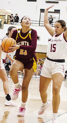 Clinton’s Ella Redshin, left, fights her way to the basket during the Lady Reds’ road game against Weatherford. CDN | Sam Goodwyn