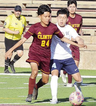 Clinton’s Oscar Soto battles with a PC West player as Adrian Martinez comes to help during the Reds’ JV soccer game Tuesday in the Tornado Dome. CDN | Sam Goodwyn