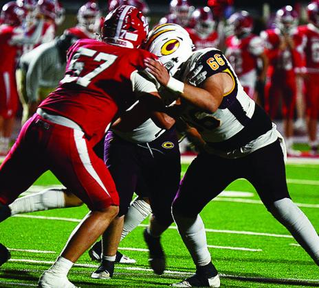 Clinton’s No. 66 Andre Lime blocks during the Red Tornadoes’ road game Thursday against Cache. CDN | Micah Ashcraft