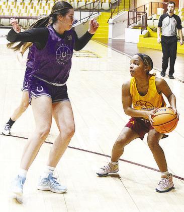 Clinton’s Peyton Clonce looks for an open teammate during the Lady Reds’ JV game against Bethany in the Tornado Dome. CDN | Sam Goodwyn