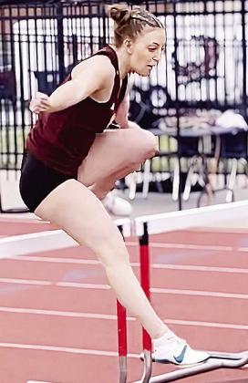 Presley Evans jumps over a hurdle during the meet in Elgin. CDN | Courtesy photo