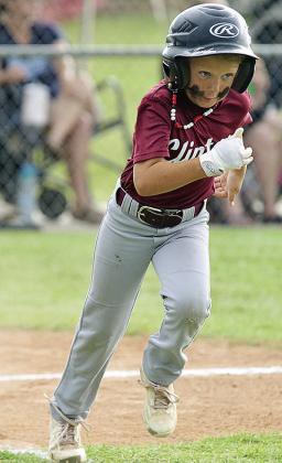 Ayden Taylor hustles to first during the Clinton Maroons’ game in the OK Kids 8U State Baseball Tournament at Schumacher Fields at Acme Brick Park. CDN | Sam Goodwyn