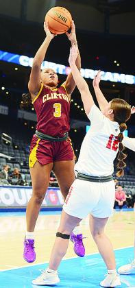 Clinton’s Arlena Kirkendoll shoots the ball over a Cache defender during the Lady Reds’ come-from-behind win over the Lady Bulldogs. CDN | Sam Goodwyn