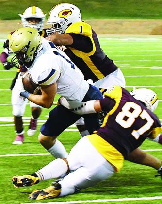 No. 1 Malachi Lorne helps No. 87 Ethan Lofland take down the ballcarrier during Clinton’s 30-27 overtime win over Kingfisher last year in the Tornado Bowl. CDN | John Kinsey