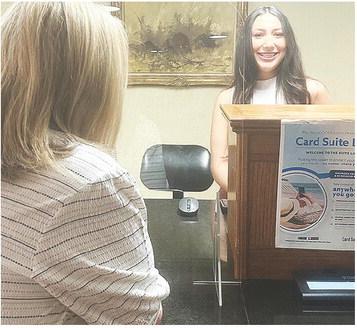 Ali Rodelo waits on a customer at First Bank and Trust. CDN | Shiann Dawson