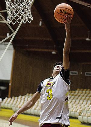 Clinton’s Titan Malone goes up for the layup during practice in the Tornado Dome. CDN | Sam Goodwyn