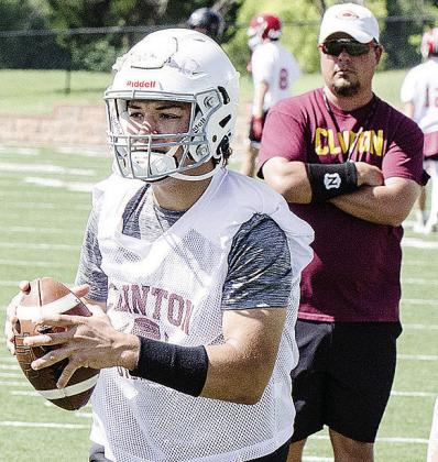 Easten Powell, front, gets watched by Head Coach Trevor Powers during 7-on-7 at the Tornado Bowl. CDN | Sam Goodwyn