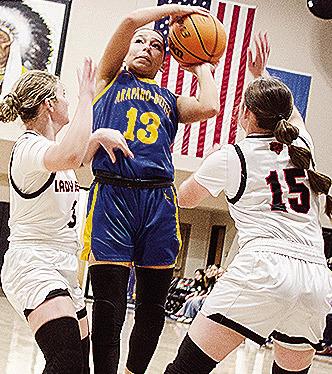 No.13 Natalie Washee shoots the ball over two Cheyenne-Reydon defenders during the championship of the Western Equipment Classic between Arapaho-Butler and the Lady Bears. CDN | Sam Goodwyn