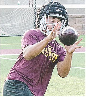 Jesus Gutierrez catches the ball during Clinton’s football practice. CDN | Sam Goodwyn