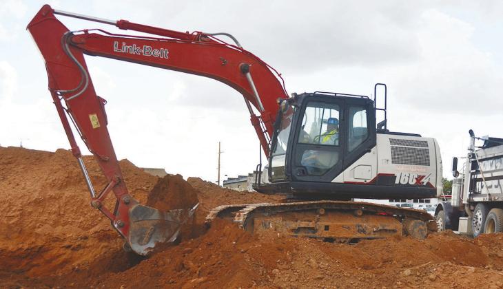Moving loads of red dirt