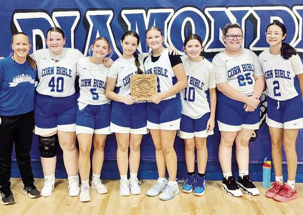CBA’s eighth-grade girls’ basketball team shows off its third-place trophy. Pictured, from left, are Coach Kris Zeller, Brynlee Redcay, Ralyn Clemons, Molli O’Hara, Finnlee Roberson, Bryndee Driskill, Brilyn LeGrand and Sonya Schmidt. CDN |Courtesy