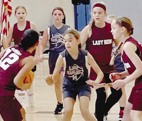 No. 12 Yami Flores looks to make a pass to her fellow teammates