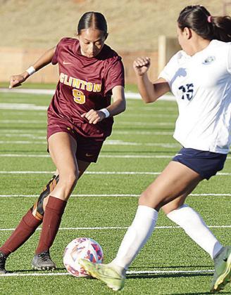 Clinton’s No. 9 Jimena Solis changes direction to avoid the Putnam City West defender in the Tornado Bowl. CDN | Sam Goodwyn