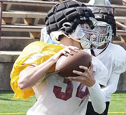 Draivyn Baker pulls the ball in before he turns upfield after the reception during practice. CDN | Sam Goodwyn
